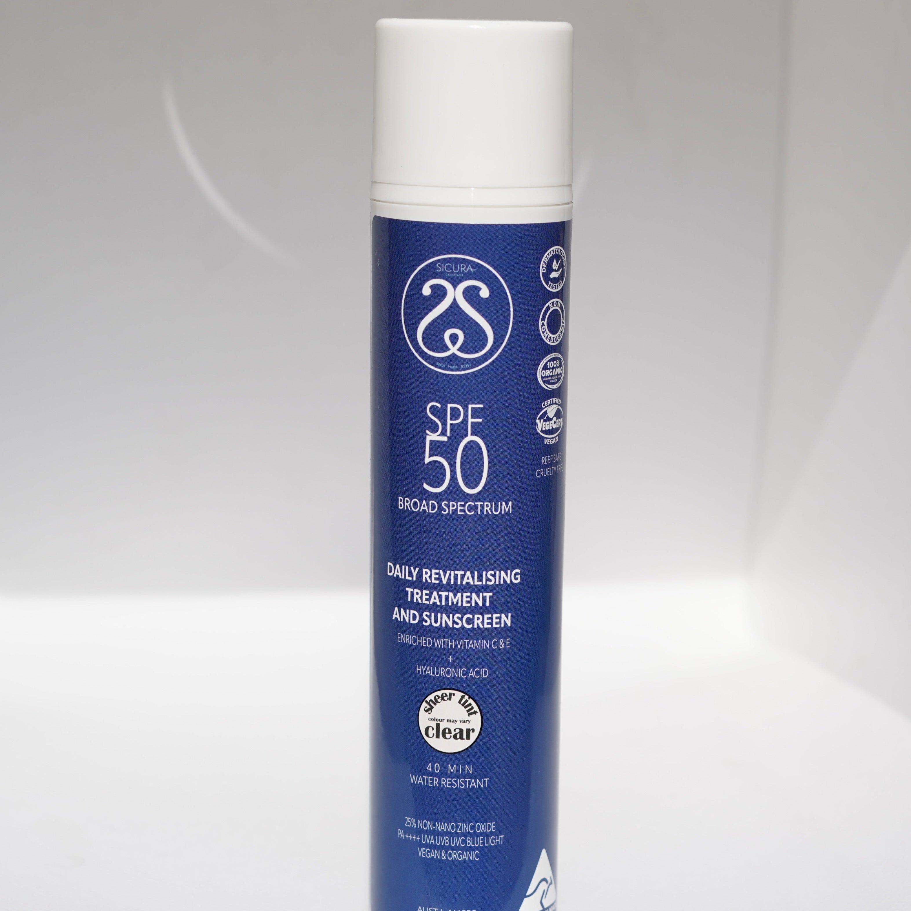 A blue aerosol can of SPF 50 sunscreen treatment and daily revitalizing treatment.